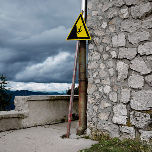 Signpost against wall, Mount Vogel, Lake Bohij, Slovenia.