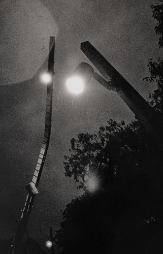 Rain falling on two street lights in Croatia