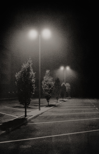 Street lights in a car park at night
