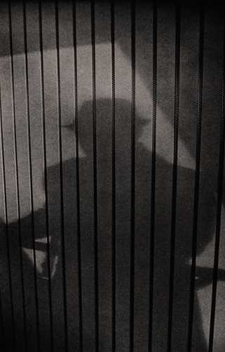 Shadow of hatted figure