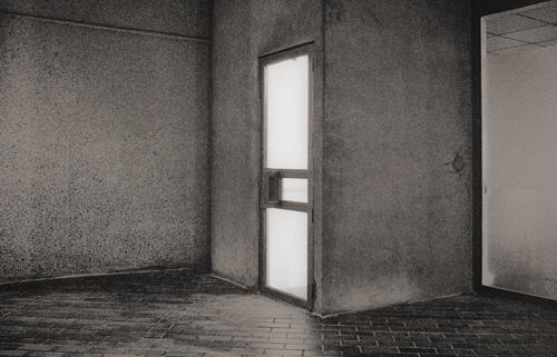 Anonymous, illuminated door at night.