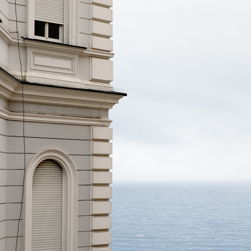 Corner of building in front of the sea in Opitija, Croatia